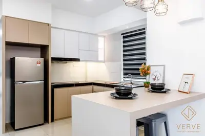 a kitchen with a refrigerator and a counter top at Lovely Home Casa Kayangan A2207 in Ipoh