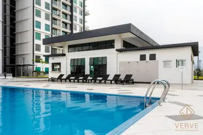 a swimming pool in front of a building at Lovely Home Casa Kayangan A2207 in Ipoh