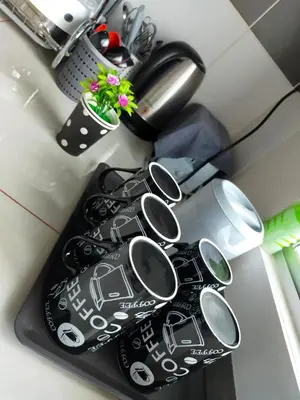 a bunch of spoons sitting on top of a counter at 80'S PARADISE in Tanah Rata