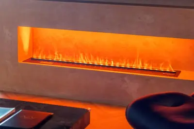 a fireplace in a room with a chair and a table at Georgetown Tropicana 218 by Airlevate Suites in George Town