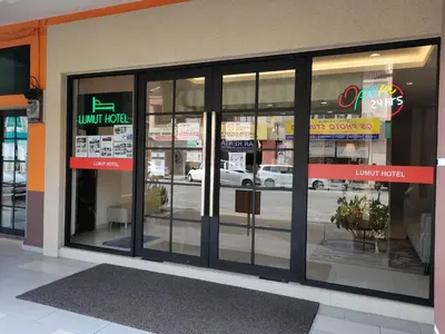a store front with glass doors in a building at Lumut Hotel in Lumut