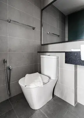 a bathroom with a toilet and a shower at Muji Studio 1 - Seaview at 218 Tropicana Near Komtar Food Heaven with Netflix & TV Box in George Town