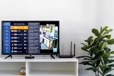 a computer monitor on a white shelf with a plant at De Pastel Studio - SeaView at 218 Tropicana NEAR Komtar Food Heaven with Netflix & TV Box in George Town
