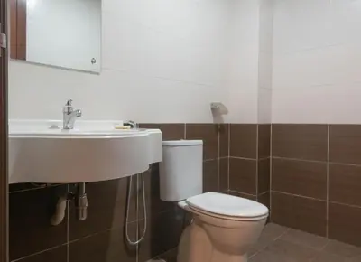 a bathroom with a white toilet and a sink at Hotel Rose Crest Hill, Cameron Highlands in Cameron Highlands