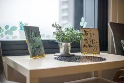 a table with two signs and a potted plant on it at Casa Orient @ Macalister 218 ❈中路218东方之家 3BR 8PAX in George Town