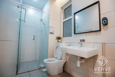 a bathroom with a toilet and a sink and a shower at Ipoh Octagon Premium Suites by Verve in Ipoh