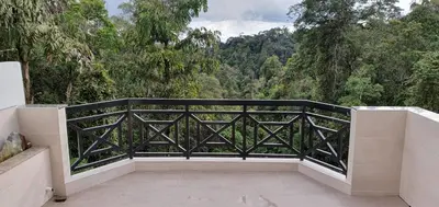 a balcony with a view of a forest at Hills Sanctuary Retreat, B7-3A-2 with WI-FI in Bukit Fraser