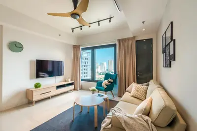 a living room with a couch and a tv at \u6d77\u666f\u623f Seaview 218 Macalister (Georgetown) \u4e54\u6cbb\u5e02\u4e2d\u5fc3 9pax in George Town