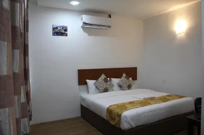a bedroom with a bed in a room at Big Apple Hotel in Kulim