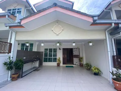 a house with a courtyard with potted plants at HILLVIEW HOMESTAY in Tanah Rata