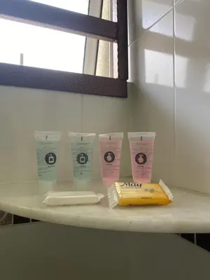 a shelf with four cups and a banana on it at HILLVIEW HOMESTAY in Tanah Rata
