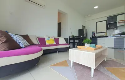 a living room with a couch and a table at Ipoh Meru Casa Kayangan by BeeStay in Ipoh