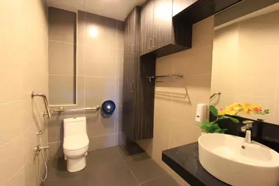 a bathroom with a toilet and a sink at Ipoh Downtown Hotel in Ipoh