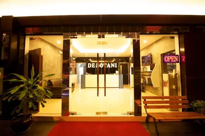 a door to a store with a bench in front of it at De Botani Hotel in Ipoh