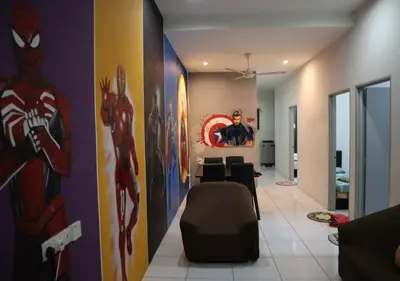 a living room with a spiderman painting on the wall at Marvel Cinematics Homes@ Station 18 , Ipoh in Ipoh