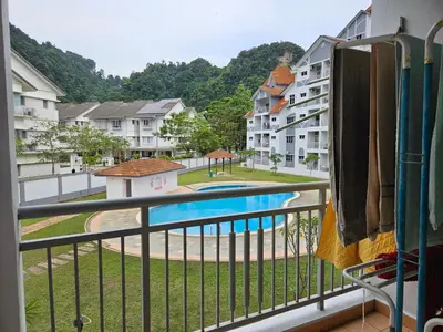 a balcony with a view of a swimming pool at Jeffrey Homestay Ipoh R at Lost World of Tambun in Tambun