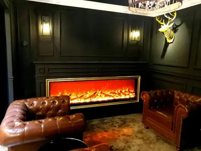 a living room with a fireplace and a leather couch at CJ HOUSE station 18 Ipoh in Ipoh