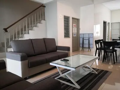 a living room with a couch and a coffee table at My Homestay N18 (14 pax) @ Golden Hills Night Market in Brinchang