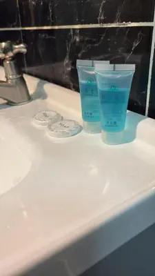 two cups sitting on top of a bathroom sink at Muslim Apartment Homestay in Tanah Rata