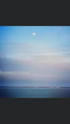 a view of the ocean and the sky at By the sea Duplex penthouse baby in Batu Ferringhi