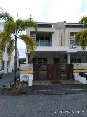 a house with a fence and a palm tree at Sweet40 Homestay in Kampong Batu Lapan