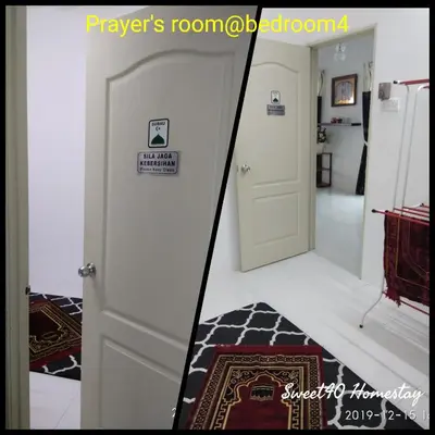 a room with a door with a sign on it at Sweet40 Homestay in Kampong Batu Lapan