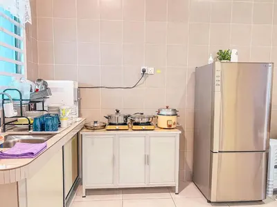 a kitchen with a stainless steel refrigerator at Golden Sweet Home @ CH Golden Hills (Night Market) in Cameron Highlands