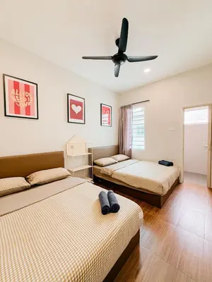 a bedroom with two beds and a ceiling fan at Golden Sweet Home @ CH Golden Hills (Night Market) in Cameron Highlands