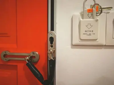 a door with a lock and a bag on it at YipStay in Gopeng