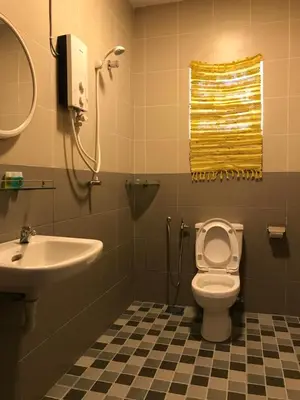 a bathroom with a toilet and a sink at Art Heritage at Lucky 7 in Ipoh