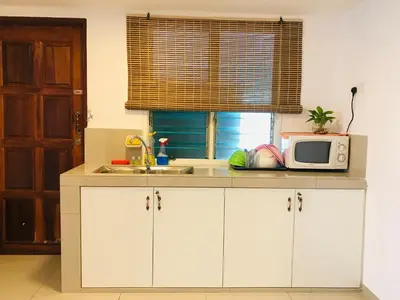 a kitchen with a microwave and a sink at Art Heritage at Lucky 7 in Ipoh