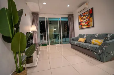 a living room with a couch and a window at Seaview Mansion One Georgetown in George Town