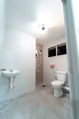 a bathroom with a toilet and a sink at Star Light Homestay 19@ The Venus in Sitiawan