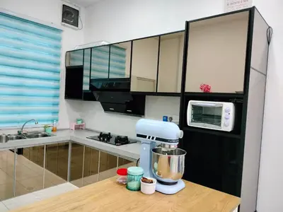 a kitchen with a mixer on top of a counter at Bismillah Homestay Muslem NETFLIX UNIFI HIGH SPEED in Kamunting
