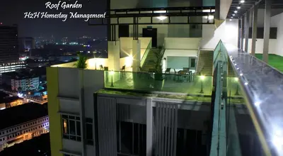 a view of a building with a balcony at night at H2H - Neo Casual - Majestic Ipoh Town Center - 8pax in Ipoh