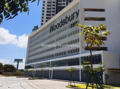 a building with a sign on the side of it at Miracle Woodsbury Habour Place Butterworth in Butterworth