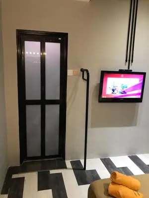 a room with a tv on the wall at Kavy Boutique Hotel @ KBH in Brinchang