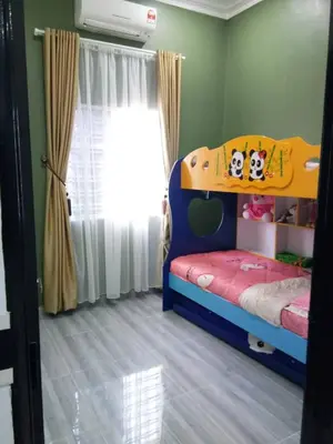 a childs bedroom with a bunk bed and a window at Serantau Mayang by the Bliss in Bagan Serai