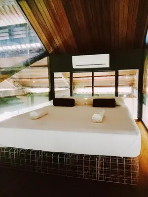 a large bed in a room with a window at Belakang KongHeng By DreamScape in Ipoh