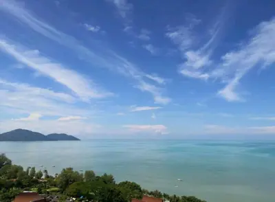 a view of the ocean under a blue sky at Deluxe VIP Seaview Batu Ferringhi 1503 - 3 Rooms in Batu Ferringhi