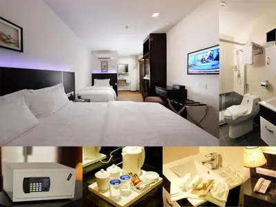 a hotel room with a bed and a bathroom at ERNES Hotel Bayu Mutiara in Bukit Mertajam