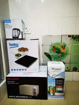 three boxes sitting on a counter in a kitchen at Bidor Totoro and One piece animation house in Kampong Kuala Gepal
