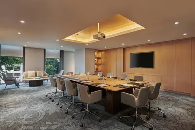 a conference room with a long table and chairs at Courtyard by Marriott Penang in George Town