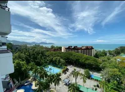 a view of a resort with a pool and the ocean at Pantai Seaview Resort Batu Ferringhi 1801 - 3 Rooms in Batu Ferringhi