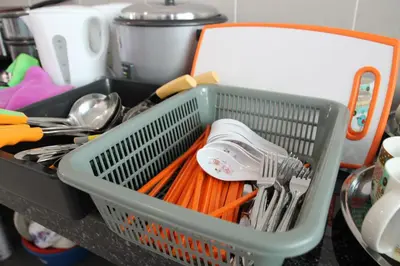 a dish basket filled with utensils on a counter at Bricks Terrace House 4R 3BR (Near to Night Market) in Brinchang