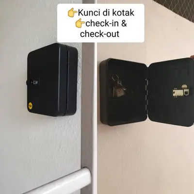 a sign for a door with a lock on a refrigerator at PoolView Resort Batu Ferringhi 502 - 2 Rooms in Batu Ferringhi