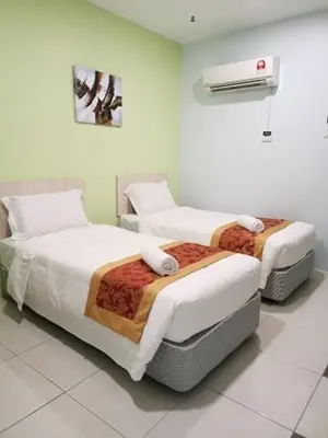 a room with two beds and a air conditioner at LH Hotel Langkap Perak in Kampung Degong