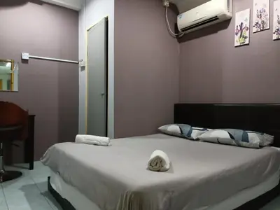 a hospital room with a bed with towels on it at Hotel Tropicanna Pulai Point in Ipoh