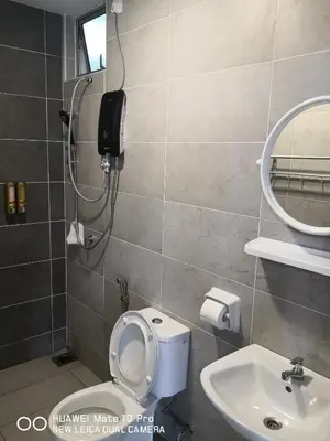 a bathroom with a toilet and a sink at Mcz homestay ipoh town 2room 7pax free wifi in Ipoh