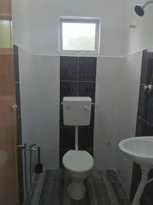 a bathroom with a toilet and a sink at FAFA ROOMSTAY TANJUNG MALIM in Tanjung Malim